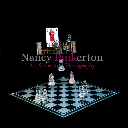 Photographic art print with image of a playing card featuring King David II and king piece behind a locked gate floating above a chessboard with chess pieces strategically placed to guard the gate.